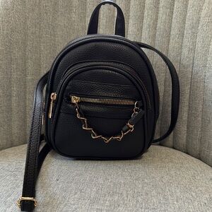 Under One Sky Black and Gold Backpack with Chain Detail